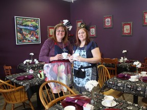 Wonderland Tea Room and Bake Shop, which opened last month on Fifth Avenue in St. Thomas, offers 20 different types of tea. Owner Lori McClymont, left, and employee Brandy Erwin dressed up in “Alice in Wonderland” themed outfits. (Laura Broadley/Times-Journal)