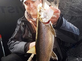 Using the Humminbird Flasher, this healthy lake trout took to a white tube jig as it was on the fall while hitting the hard water on the opener. Photo supplied