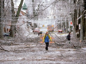 Pedestrians walk along Bagot Street during the first day on the 1998 ice storm in Kingston on Jan. 8, 1998.  (Ian MacAlpine/Whig-Standard file photo)