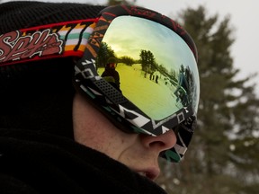 Reid Hensen?s ski goggles reflect the hill and lift at Boler Mountain in London on Tuesday. Boler has had a banner start to the season with a new $6-million chalet keeping people on the property longer and in comfort. (MIKE HENSEN, The London Free Press)