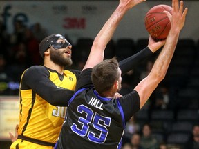 Royce White of the London Lightning goes up for a layup against Derek Hall of the Kitchener-Waterloo Titans during a National Basketball League of Canada game Friday at Budweiser Gardens. The Lightning won 115-106. (MIKE HENSEN, The London Free Press)