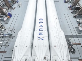 This photo made available by SpaceX shows the new Falcon Heavy rocket in a hangar at Cape Canaveral, Fla. It is scheduled for a test flight in January. (SpaceX via AP)