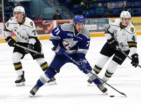 David Levin, middle, of the Sudbury Wolves, breaks between two players from the London Knights during OHL action at the Sudbury Community Arena in Sudbury, Ont. on Friday January 5, 2018. John Lappa/Sudbury Star/Postmedia Network