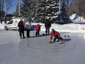 Some novice curlers braved the cold in Victoria Park Saturday to try their hand at the classic winter sport and get expert instruction (Hank Daniszewski London Free Press)