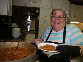 Salvation Army employee Carm Knapp, prepares a warm meal for people who will flock to the warm room operated by the agency throughout the winter months. It is one of several warming centres opened in Belleville and Prince Edward County over the weekend.