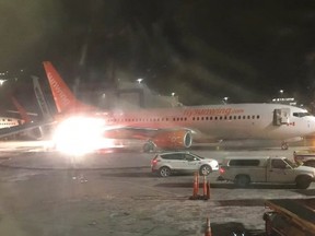 Two planes collide on the tarmac at Pearson International Airport in a photo from the Facebook page of Connie Carson. Officials say an empty Sunwing plane that was being towed struck a WestJet aircraft, which was carrying 168 passengers and six crew members, while both planes were on the tarmac at Toronto's Pearson International Airport on Friday evening. THE CANADIAN PRESS/HO-Facebook-Connie Carson