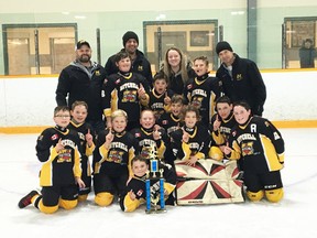 Members of the Mitchell Atoms celebrate their championship in the West Grey tournament Sunday, Jan. 7. SUBMITTED