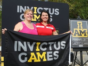 Postmedia file photo
National Silver Cross mother Colleen Fitzpatrick (left) and Invictus competitor Retired Master Cpl. Denise Hepburn hold the Invictus flag during a ceremony on Sept. 18, 2017. Hepburn will be the keynote speaker at this year’s achievement breakfast for the United Way Hastings & Prince Edward.