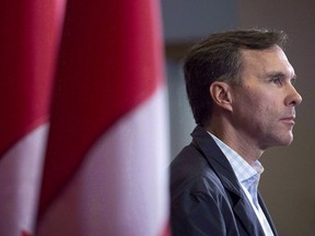 Finance Minister Bill Morneau takes questions as the Liberal cabinet meets in St. John's, N.L. on Tuesday, Sept. 12, 2017. THE CANADIAN PRESS/Andrew Vaughan