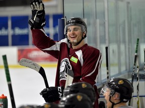 London Knights forward Sam Miletic responds to chirping from his teammates after getting cut on the chin during practice at the Western Fair on Wednesday March 22, 2017. (MORRIS LAMONT, The London Free Press)