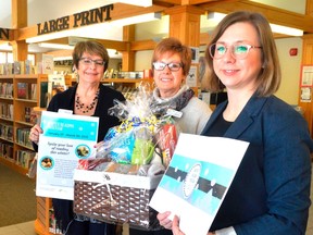 From left, Shelley Fleming, Janet Given, and Sandra Poczobut, with the Elgin County Library, hold promotion material for the library's upcoming Winter Reading Program. The all-ages event highlights the efforts being made by the rural branches to adapt to the needs of the communities in which they reside. (Louis Pin/Times-Journal)