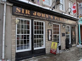 Sir John's Public House in Kingston on Tuesday January 9, 2018 before new signs were placed on the walls. Ian MacAlpine / Whig-Standard/Postmedia Network
