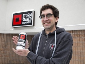 Justin Belanger, brewmaster and co-owner of Storm Stayed Brewing Company, shows off Daybreak Blonde, one of the brewery?s mainstay beers. (DEREK RUTTAN, The London Free Press)