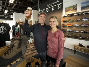 Aaron and Emily Hendrikx combine running and hiking shoe sales with craft beer at BackRoads Shoes and Brews. (MIKE HENSEN, The London Free Press)