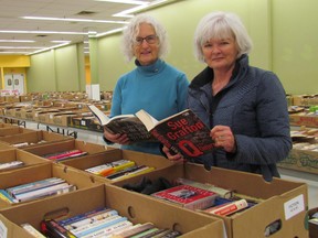 Looking over some of the thousands of used books available at the Rotary Club of Sarnia Bluewaterland 14th annual book sale at Bayside Centre are Camilla McGill, left, book sale co-chairperson, and volunteer Sue Dupee. The sale opens Friday, 8:30 a.m. and runs to 6 p.m. It continues Saturday, 9 a.m. to 5 p.m., and Sunday, 11 a.m. to 4 p.m.
(Paul Morden/Sarnia Observer)