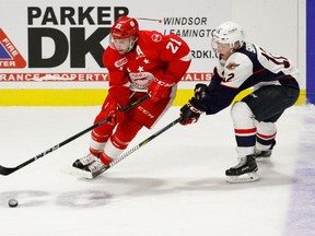 Defenceman Conor Timmins #21 of the Sault Ste. Marie Greyhounds moves the puck against forward William Sirman #12 of the Windsor Spitfires on October 5, 2017 at the WFCU Centre in Windsor, Ontario, Canada. (Dennis Pajot/Getty Images)