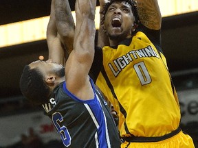 Mo Bolden of the London Lightning goes to the basket defended by Kitchener-Waterloo Titan Denzel James during a National Basketball League of Canada game at Budweiser Gardens on Wednesday. The Bolts won 129-98. (MORRIS LAMONT, The London Free Press)
