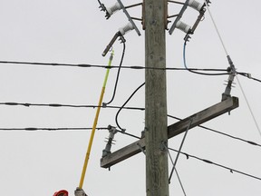 Utilities Kingston worker repairs line on Railway Street just west of Montreal street around 9 a.m. during a power outage on Thursday, Jan. 11, 2018. Ian MacAlpine, Kingston Whig-Standard, Postmedia Network