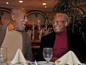In this Wednesday, Jan. 10, 2018 photo, Bill Bill Cosby, left, has dinner with childhood friend Ed Ford at an Italian restaurant in Philadelphia. Cosby's new trial on charges he drugged and molested a woman in 2004 was supposed to begin in November, but was delayed until this spring so his new legal team could get up to speed. Jurors deadlocked in June and the judge declared a mistrial. He has said the encounter was consensual. (Tim Gralish/The Philadelphia Inquirer via AP)