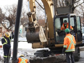 Workers with Vozza Contracting dig into Sycamore Drive, east of Indian Road, to repair a broken water main Thursday. It was one of 18 water main breaks in Sarnia since Wednesday, and one of about 40 since Jan. 1. (Tyler Kula/Sarnia Observer)