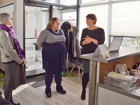 Saffron executive director Katie Kitschke (right) talked about the new enhancements of Saffron’s new facility to Health Minister Sarah Hoffman (middle) and Sherwood Park MLA Annie McKitrick during an open house in February.
