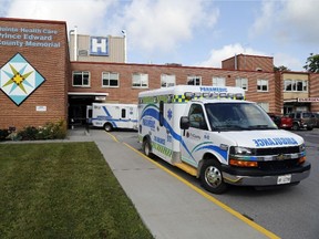 Luke Hendry/The Intelligencer 
Ambulances wait outside Prince Edward County Memorial Hospital in Picton. The South East Local Health Integration Network board is expected later this month to approve the first phase of the plan to build a new hospital behind the existing one.