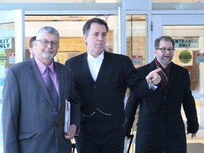 Ex-Sarnia fire chief, Patrick Cayen, left, leaves the Sarnia courthouse with his lawyer Phillip Millar. On the right is assistant Crown attorney James Boonstra who is prosecuting the case. (NEIL BOWEN/Sarnia Observer)