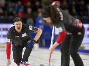 Becca Hamilton sweeps for her brother Matt Hamilton as they play mixed doubles against Sofia Mabergs and Niklas Edin at the Continental Cup at the Western Fair Sports Centre on Thursday. (MIKE HENSEN, The London Free Press)