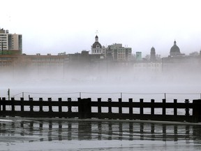 Kingston's downtown skyline appears above the fog for the LaSalle Causeway during a windy, rainy morning on Friday January 12 2018. Ian MacAlpine/The Whig-Standard/Postmedia Network