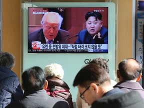 Ahn Young-joon/The Associated Press
People watch a TV screen showing images of U.S. President Donald Trump, left, and North Korean leader Kim Jong Un, at the Seoul Railway Station in Seoul, South Korea, on Nov. 21. Critics called Kim’s mixed message in his New Year’s Day speech a gambit to drive a wedge between Seoul and Washington to weaken U.S.-led international pressures or buy time before perfecting nuclear weapons targeting the United States. The Korean letters on the screen read: "UN sanctions, the blow is not big."