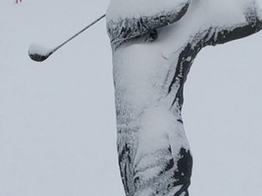 At the Oakwood Resort in Grand Bend, the facility’s golfing statue outside of its dining hall was covered with snow earlier this week when this photograph was taken. Travel columnist Bob Boughner writes that the cold and snow of the last few weeks has been great for Ontario’s tourism business. (Lynda Hillman-Rapley/Postmedia Network)