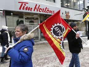 Union workers and supporters gathered to demonstrate in front of Tim Hortons on Sparks Street in Ottawa Wednesday Jan 10, 2018.Tony Caldwell / Postmedia Network