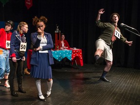 Photo courtesy of Mark Aidan Bergin
Competitors, from left, Cameron Durst-Jerkins, Oliver Parkins, Rachel Lutz, and Aliya Howard wait for Jake Tallon to finish spelling his word, while Kim Dolan looks on, in Blue Canoe Productions' The 25th Annual Putnam County Spelling Bee.