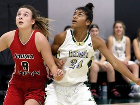 Northern Vikings' Avery Bathe-Minard (8) and Jennah Taylor (24) of the St. Patrick's Fighting Irish wait for a rebound during the LKSSAA AAA senior girls' basketball final at St. Patrick's Catholic High School in Sarnia, Ont., on Saturday, Nov. 11, 2017. (Mark Malone/Chatham Daily News)