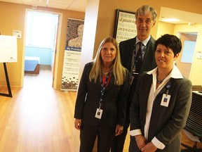 Bluewater Heatlh's Laurie Hicks, Mike Lapaine and Paula Reaume-Zimmer stand at the entrance of a seven-bed residential detox facility opening in Sarnia hospital Monday. It's an interim measure while officials work to secure final details and funding for a 24-bed standalone residential detox hub. (Tyler Kula/Sarnia Observer)