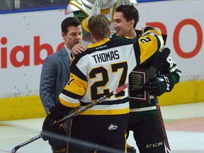 Former London Knight Robert Thomas and Knights forward Alex Formenton are presented with plaques honouring their World Junior gold medal win with Team Canada by Knights general manager Rob Simpson before the beginning of the first period of an Ontario Hockey League game at Budweiser Gardens in London, Ontario on Friday Jan 12, 2018. (MORRIS LAMONT, The London Free Press)