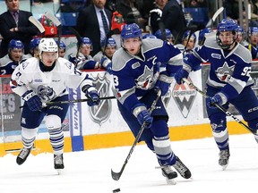 Kyle Rhodes, middle, of the Sudbury Wolves, breaks to the net during OHL action against the Mississauga Steelheads at the Sudbury Community Arena in Sudbury, Ont. on Friday January 12, 2018. John Lappa/Sudbury Star/Postmedia Network