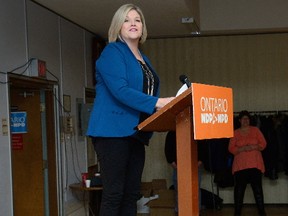Ontario NDP Leader Andrea Horwath doesn?t let an oversized podium get in the way as she lambastes Premier Kathleen Wynne?s governing Liberals and Patrick Brown?s surging Tories Sunday. (MORRIS LAMONT, The London Free Press)