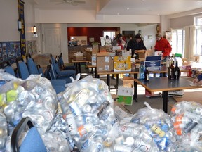 Terry Vollum/For The Intelligencer
Stirling Rotarian Donna Graff (foreground) sorts and counts the many bottles and cans donated by local residents to the local service club’s first annual bottle drive held in the first week of the new year. The fundraiser netted more than $1,000 in support of Station Park – an ambitious two-year project undertaken by Stirling Rotary to create a beautiful park-like setting on the undeveloped and overgrown land immediately west of the historic railway station.
