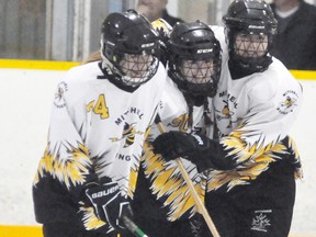 Bree Belfour, Brianna Cook and Sami McCarthy of the Mitchell U16 ringette team celebrate a goal during recent action. ANDY BADER FILE/MITCHELL ADVOCATE