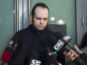 Joshua Boyle speaks to the media after arriving at the airport in Toronto on Friday, October 13, 2017. THE CANADIAN PRESS/Nathan Denette ORG XMIT: CPT106