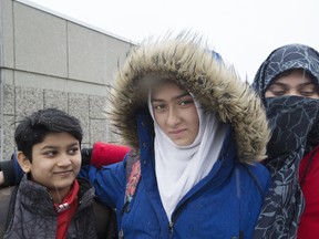 Khawlah Noman appears before the media with her mom Saima Samad (right) to talk about an alleged assault on the way to Pauline Johnson Public School in Scarborough on Friday January 12, 2018. (Stan Behal/Toronto Sun/Postmedia Network)