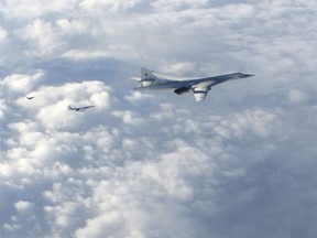 In this image made available by the Royal Air Force Monday, Jan. 15, 2018, two Russian Blackjack Tupolev Tu-160 long-range bombers are followed by an RAF Typhoon aircraft, left, scrambled from RAF Lossiemouth, Scotland. Royal Air Force / AP