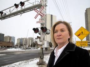 Sharon von Behr, of London, lost her son John Jobson, 22, to a train crossing collision near Glencoe in July 2011. Moved by the death of Malcolm Trudell, 26, last week, von Behr is urging action to improve the safety of the Colborne Street crossing with barriers for pedestrians. (MIKE HENSEN, The London Free Press)