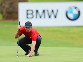 Mike Weir of Canada lines up a putt on the 17th green during Day One of The BMW South African Open Championship. (Getty Images)