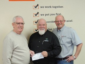 The Dutton Dunwich Splash Pad project has received $5,000, courtesy of the Dutton & District Lions Club which held a trivia night as a fundraiser. From left is Lions Club trivia committee chair Mike Brady, Deputy Mayor Bob Purcell, and Brian Downie, president and CEO of West Elgin Mutual Insurance, corporate partner with the project.