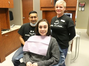 BRUCE BELL/THE INTELLIGENCER
Kelsey Ubdegrove of Picton is pictured with Dr. Kuldeep Sandhu and hygenist Krista Lambert of Picton Dental Centre at the 6th Annual Dentistry From the Heart event on Friday.