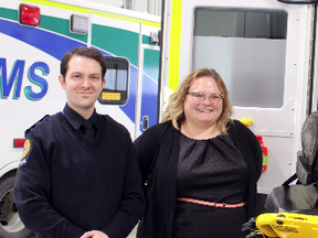 Deputy Premier Sarah Hoffman (Centre) joins Stony Plain MLA Erin Babcock (right) during a tour and demonstration of the new power stretcher equipment at the Stony Plain/Parkland EMS building.