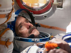 NASA/Victor Zelentsov
Flight Engineer Chris Hadfield of the Canadian Space Agency conducts a “fit check” dress rehearsal inside the Soyuz TMA-07M spacecraft in 2012. Along with Soyuz Commander Roman Romanenko and Flight Engineer Tom Marshburn of NASA, who are not pictured, Hadfield was preparing for launch for a five-month mission on the International Space Station.