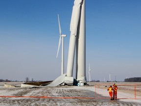 These workers erect a temporary fence around this industrial wind turbine on Friday, January 19, 2018, that buckled at the half-way point. The turbine, located on Sixteenth Line in south Chatham-Kent, Ont., is part of the Raleigh Wind Energy Centre, owned by TerraForm Power Inc. and SunEdison Inc. (Ellwood Shreve/Chatham Daily News/Postmedia Network)